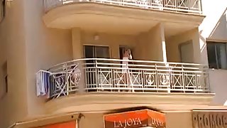 Voyeur 21, A babe no panties at her balcony