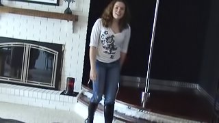 Jeans-clad stripper with long dark hair touching her sexy body