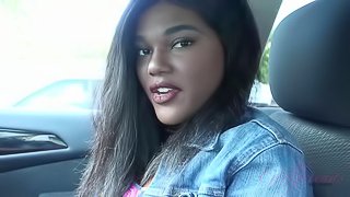 A sea turtle practically grazes Yara's legs at the beach