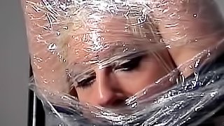Pretty girl wrapped in plastic
