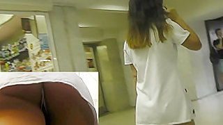 Dark-haired babe caught on the upskirt camera