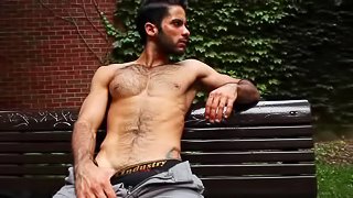 Muscular gay Tony Milan is masturbating his dick