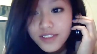Asian american girl has phonesex with her bf and shows herself naked on cam