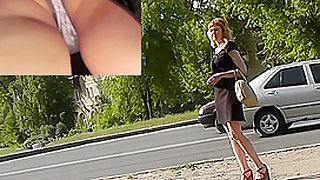 Woman in tight skirt waits for bus in upskirt video