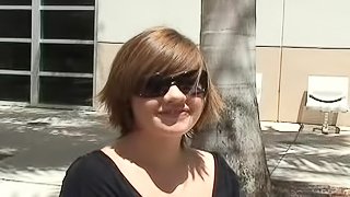 Smiling chick is sucking a tasty prick