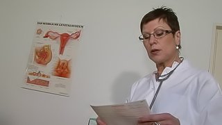 Short-haired MILF doctor with a wet pierced pussy masturbating