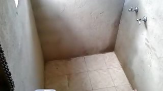 Voyeur tapes a hot latina girl showering