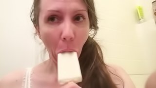 Hairy MILF gets messy with a creamy white coconut popsicle