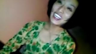 Exotic looking asian girl happily sucks on a small dark penis