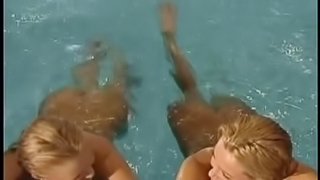 Two hot blondes swim in a pool and have a lesbian sex