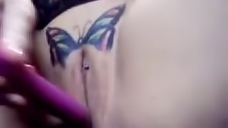 Pussy with a butterfly tattoo gets dildoed deep