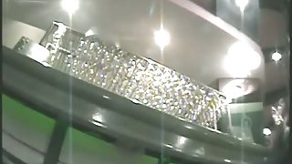 Sexy barmaid gives us an upskirt view of her butt