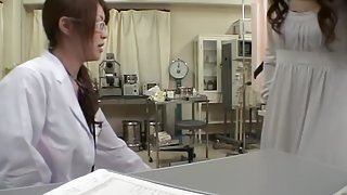 Beauty banged by a strapon dick during pussy examination