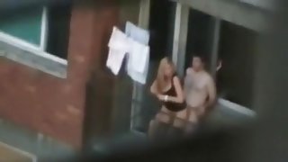 Voyeur captures the neighbors having sex on the balcony