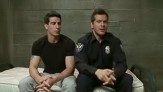 Police officer ties up a guy and toys his ass in a prison