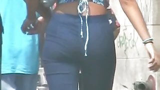 Hot asses in denim wiggling around the street candid video