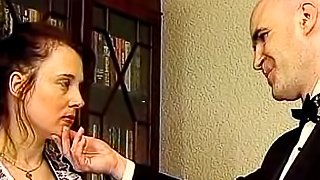 Naughty maid spanked across her ass