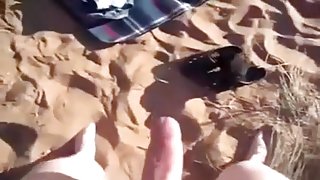My wife fingers her pussy on a beach after sucking my cock