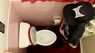 Devin Reynolds grabs his cock and unloads in the toilet