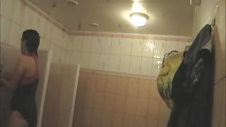 Swimmers in and without swimsuits on shower spycam